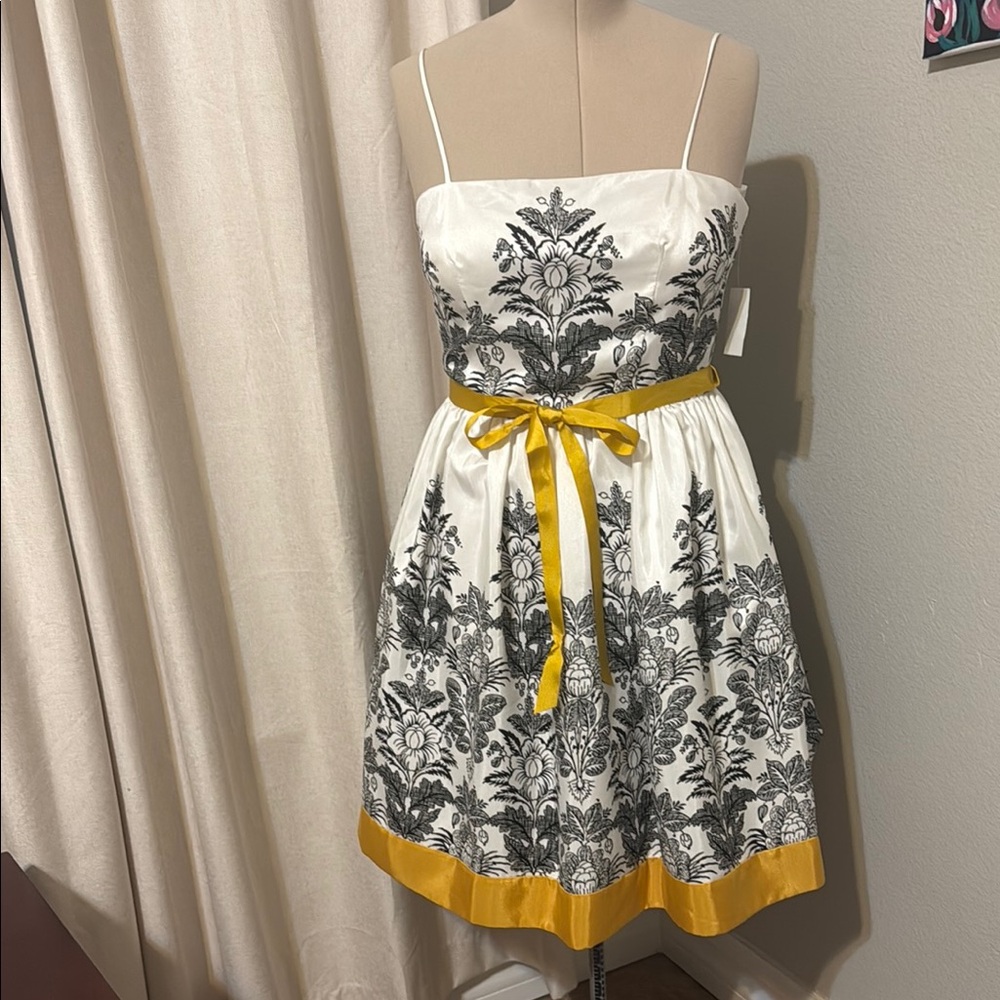 Elegant White and Black Floral Dress with Yellow Accents